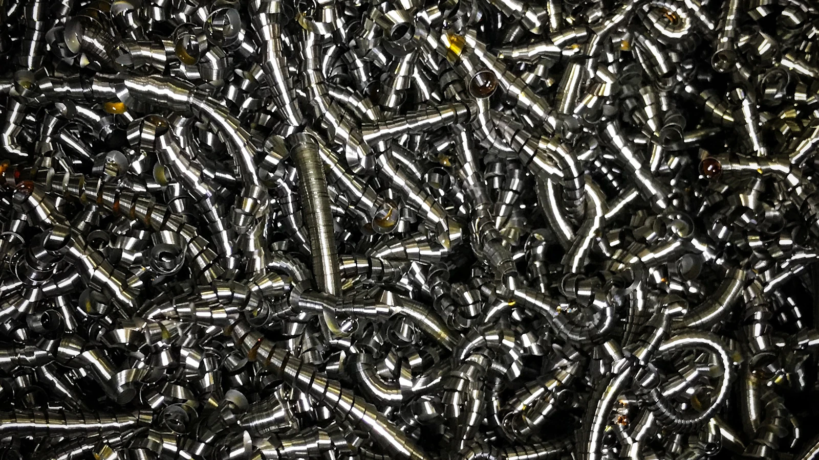 Curled metal shavings from machining work viewed close up.