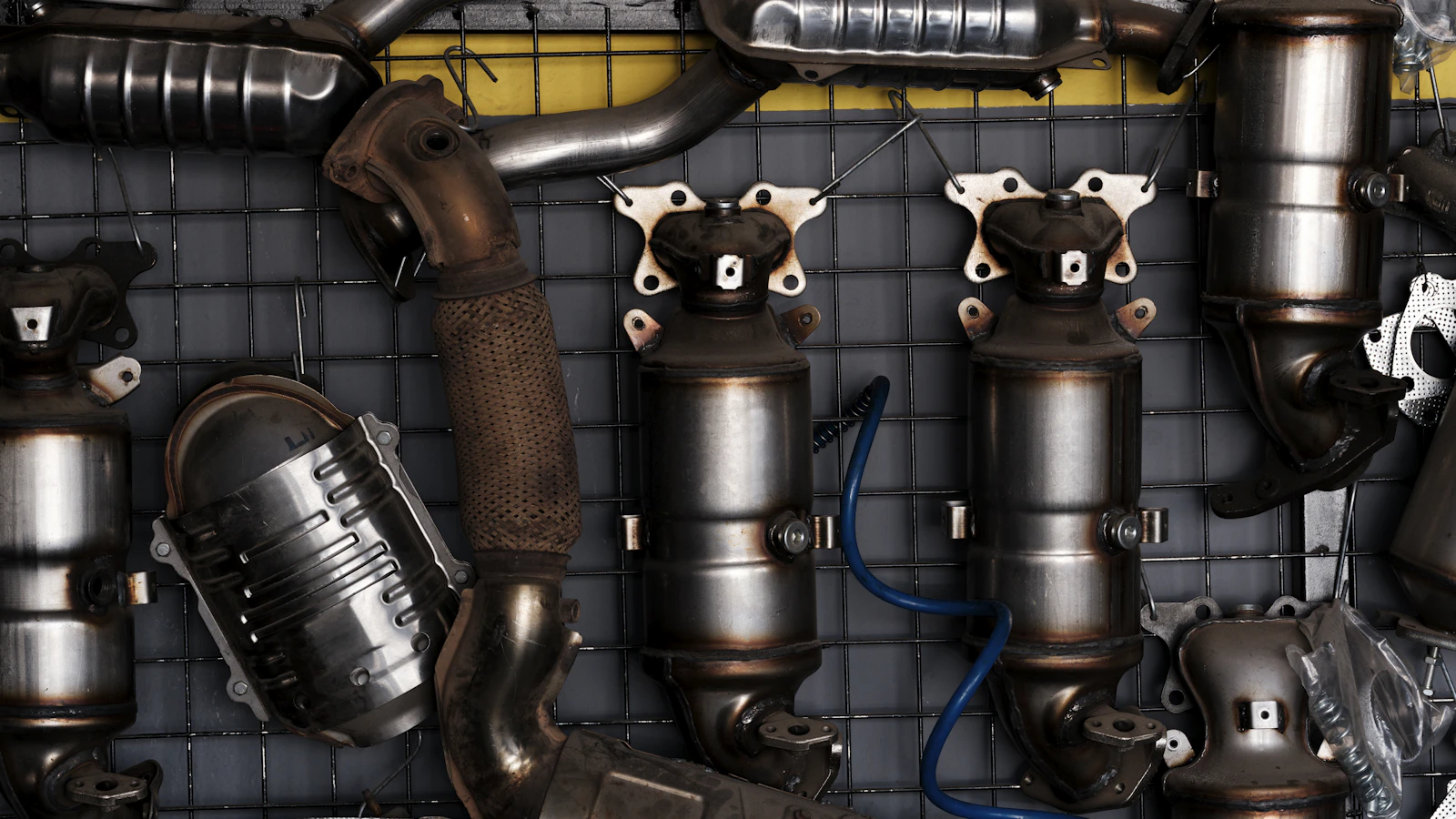 Exhaust pipes and other automotive exhaust components stored together.