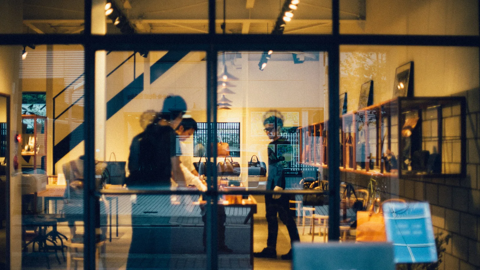 Group of people inside cafe.