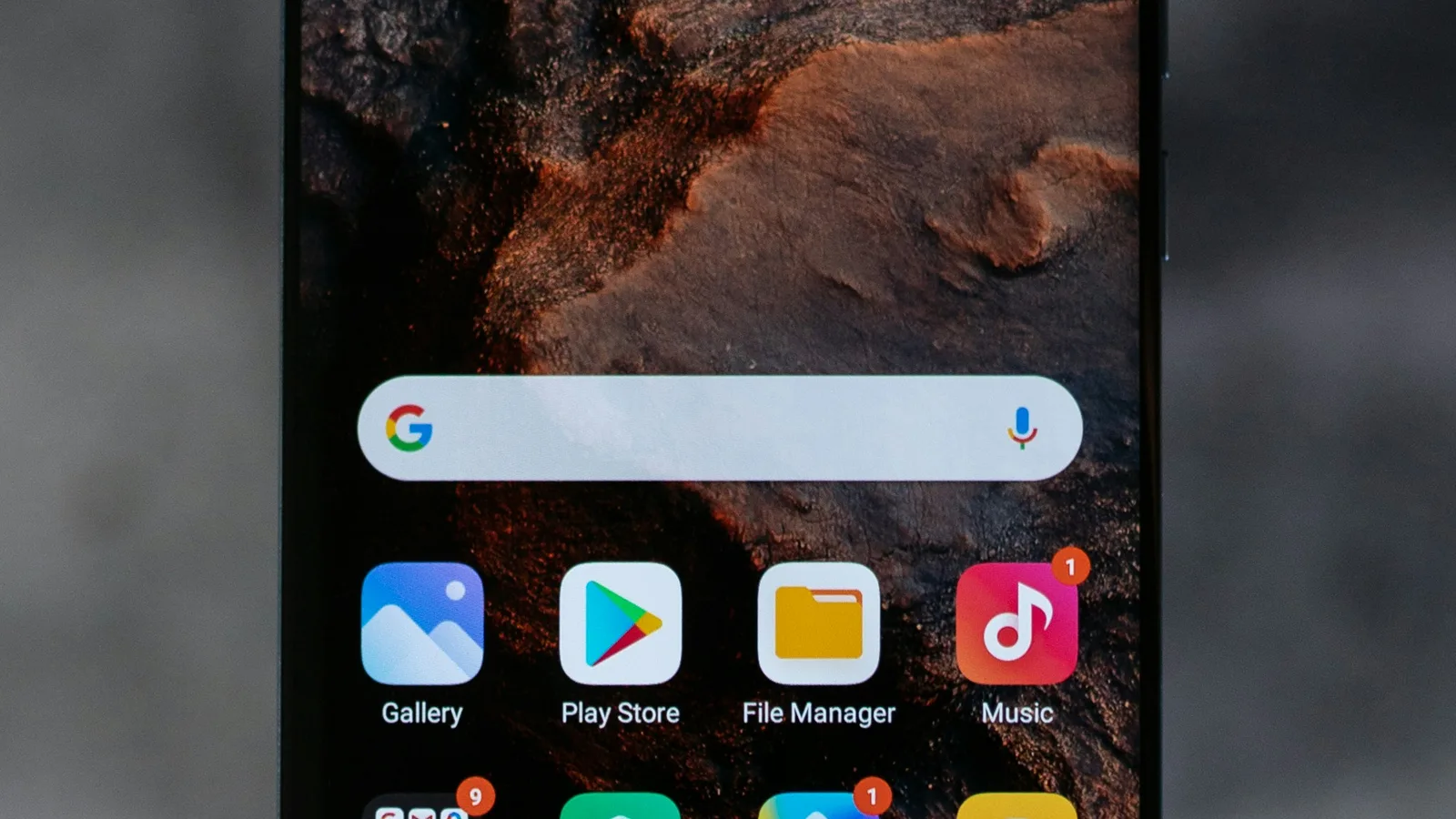A smartphone screen displaying a home screen with various app icons and widgets.