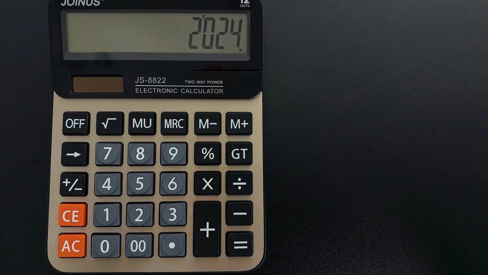 A calculator sitting on top of a table.