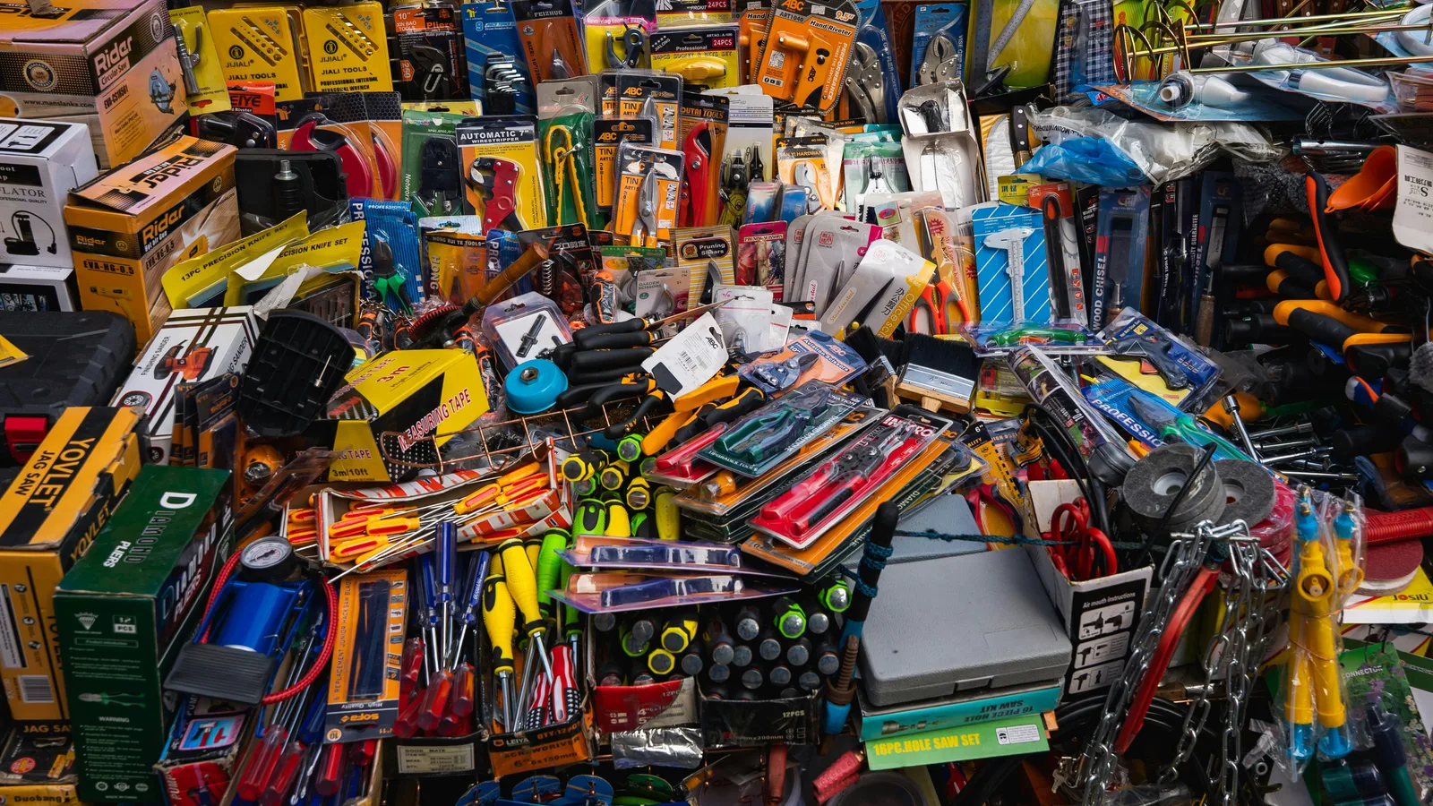 A cluttered display of various tools and hardware items.
