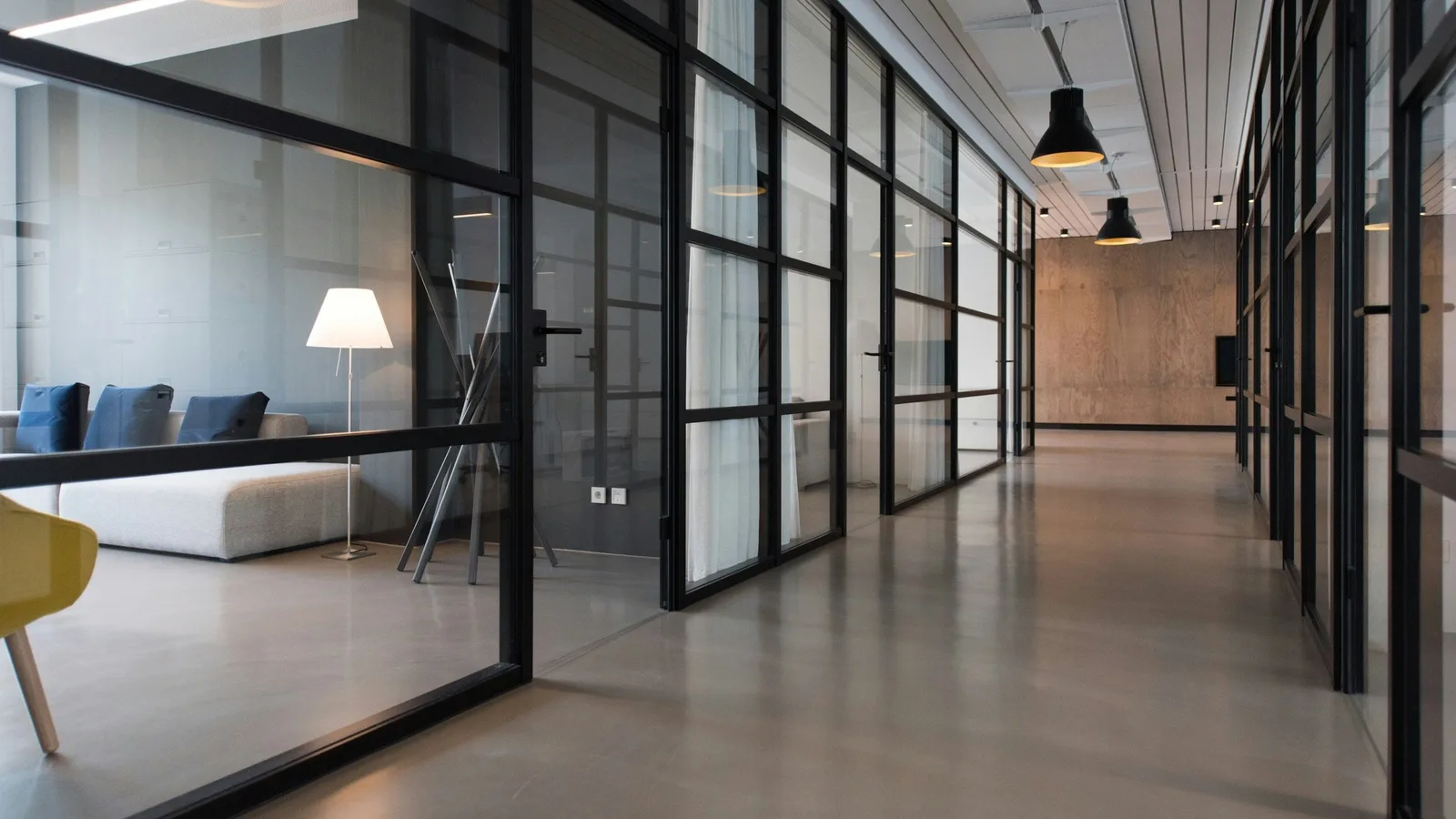 Hallway between glass-panel doors.