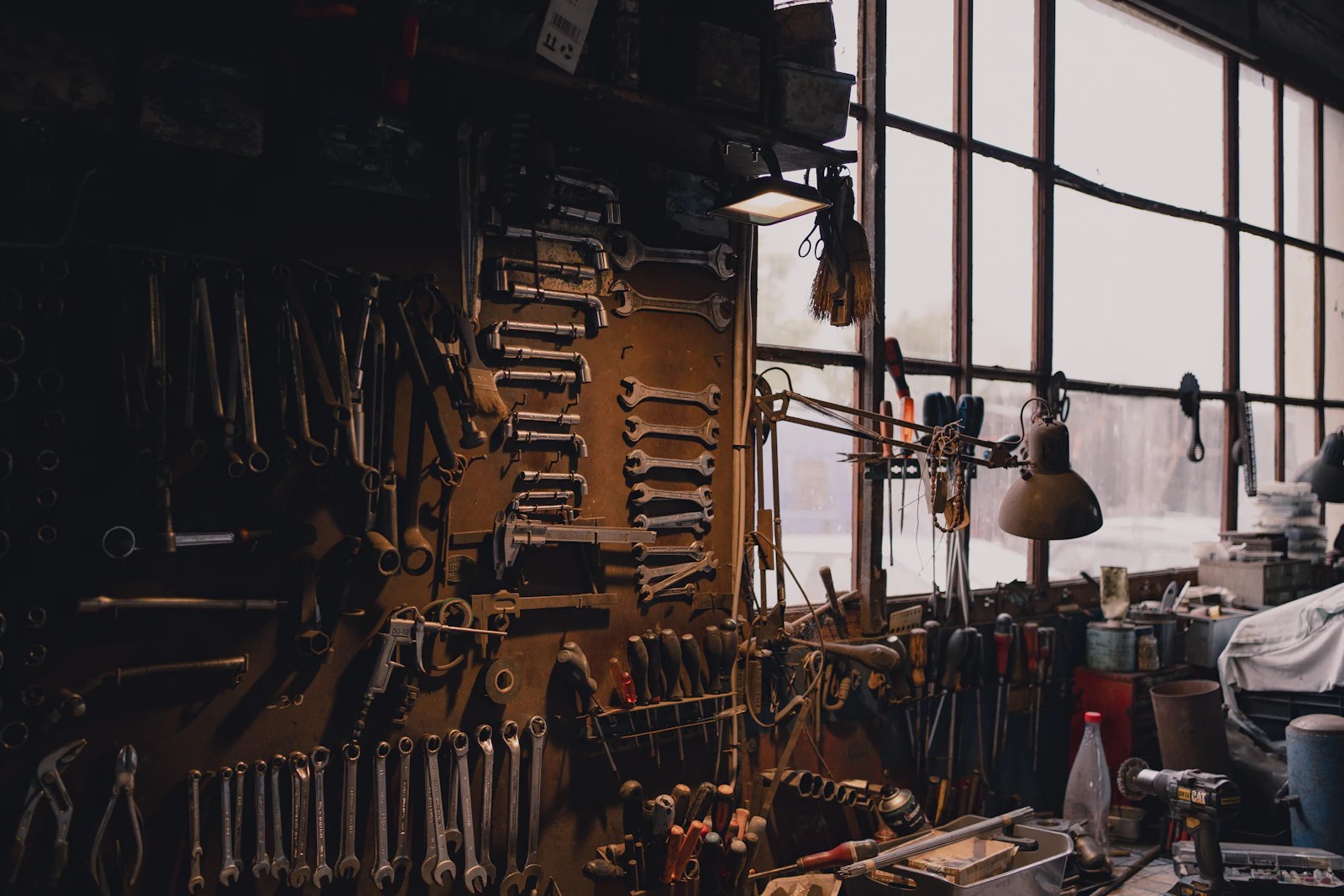 Mechanic working beside a vehicle in an independent garage